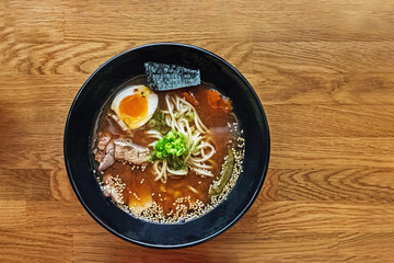 Delicious traditional japanese soup ramen on the wooden table