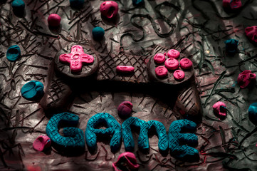 colorful illustration plasticine texture smeared on the board for modeling game joystick and the inscription game