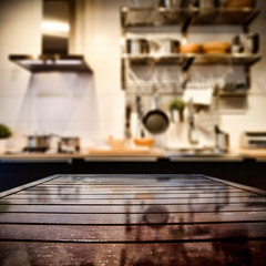 Brown wooden kitchen table and free space for your decoration. 