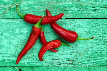 Red hot chili pepper on green boards