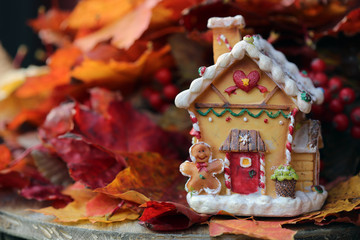 christmas gingerbread cookies and decorations with dolls and autumn leaves 