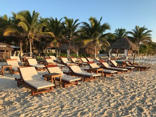 chairs and umbrella on tropical beach