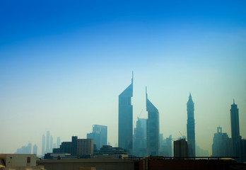 Fototapeta na wymiar modern buildings in Dubai city under blue sky