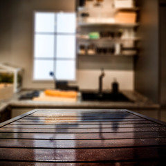 wooden desk of free space and kitchen interior 