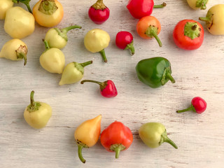 colorful fresh peppers on a wooden table