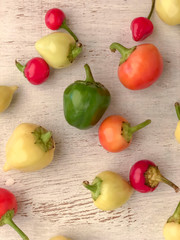 colorful fresh peppers on a wooden table