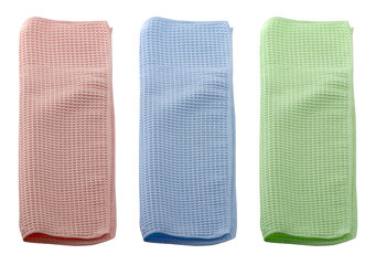 Set of microfiber dust cloths in different colors. Cloths are on a white background.