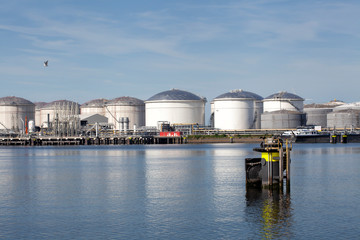 Oil refinery plant from industry zone, Aerial view oil and gas industrial, Refinery factory oil storage tank and pipeline steel