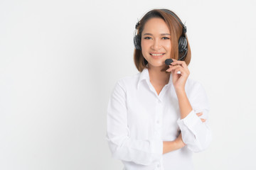 Portrait of happy smiling female customer support phone operator short hair, wearing a white shirt...