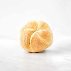 Close-up view of a single whole bread roll 