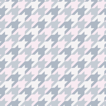 Seamless surface pattern with houndstooth ornament. Classic fashion fabric print. Checked geometric background.