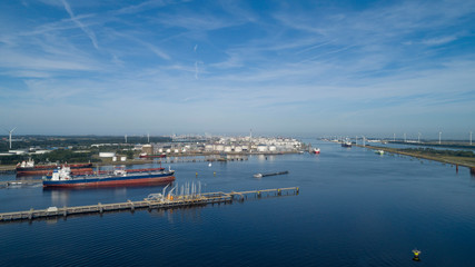 Oil refinery plant from industry zone, Aerial view oil and gas industrial, Refinery factory oil storage tank and pipeline steel