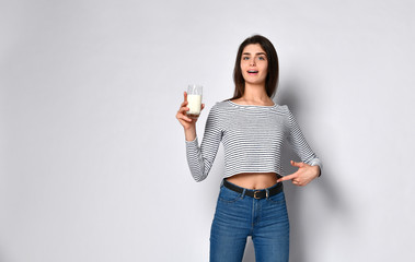 UNHappy young woman drinking milk