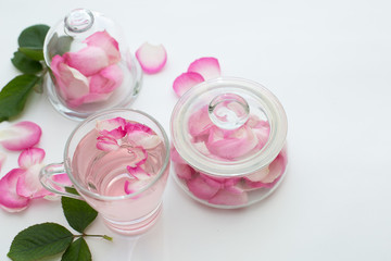 Rose  petals tea in a white background. Horizontal