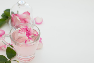Rose  petals tea in a white background. Horizontal