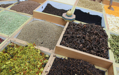 spices and herbs, Multicolored spices in a wooden organizer, top view. Seasoning background - 294476381