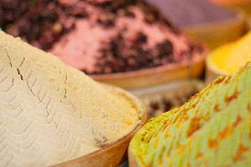 Multi-colored dried fruits and tea in the oriental bazaar.