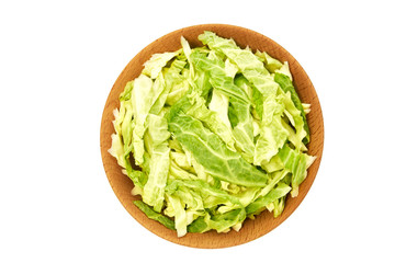 Wooden bowl with сhopped savoy cabbage isolated on white background. Top view.