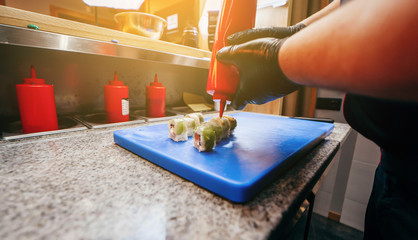 Japanese chef in restaurant cook sushi