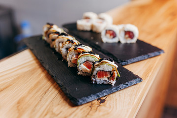 Wonderful sushi set, oriental theme on the old wooden table