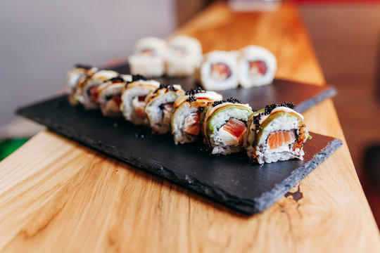 Wonderful Sushi Set, Oriental Theme On The Old Wooden Table