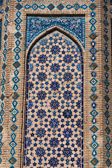 Ornate window with mosaic, detail of the facade of Bibi-Khanym mosque, Samarkand, Uzbekistan