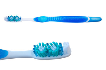 Toothbrush blue, green and white color, close-up isolated on white background