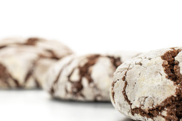 Group of three whole baked chocolate brownie cookie in row isolated on white background