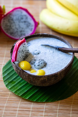 Dragon fruit smoothie in coconut bowl
