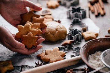 Woman with baked homemade gingerbread cookies
