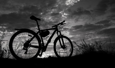 Obraz premium bike in the background fire sunset.