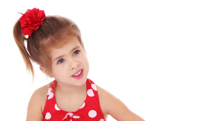 Little girl posing in the studio. Close-up.