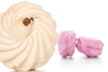 Group of three whole fresh pastel zefir apricot one in focus isolated on white background