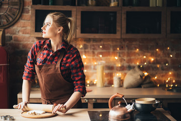 confectioner rolling gingerbread dough