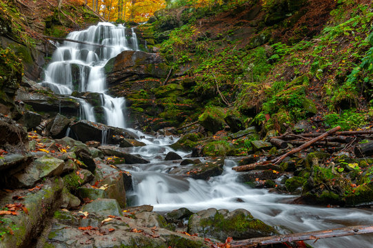 Mountain waterfall in autumn forest © byrdyak