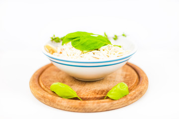 Italian pasta with tomato sauce, parmesan cheese, fresh oregano - on white background.