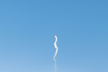 Small plane performs aerobatics in the sky
