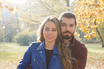 Fototapeta premium Couple in the park enjoying nice autumn time.