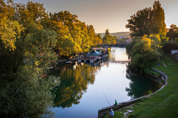 Fototapeta na wymiar Restaurant and bridge on a Vrbas river in Banja Luka, Bosnia and Herzegovina