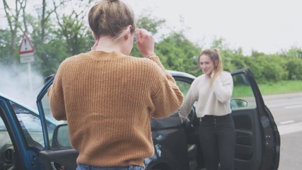 Two Female Drivers Getting Out Of Cars After Auto Accident