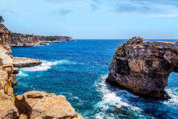 Fototapeta premium Beautiful natural rock arch at viewpoint, Mirador Es Pontas, island of Mallorca, Balearic islands, Spain