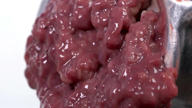 pieces of the liver come out through the holes in the meat grinder when scrolling, it looks very nasty and it looks like the human intestines are scrolling, close-up