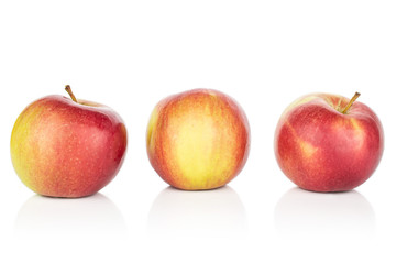 Group of three whole red apple jonagold isolated on white background