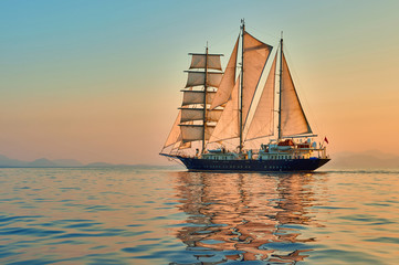 Sailing ship.  Sailboat in the sea under sail. Yachting sport and cruise