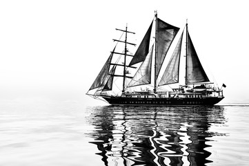 Fototapeta na wymiar Sailing ship. Sailboat in the sea under sail. Yachting sport and cruise