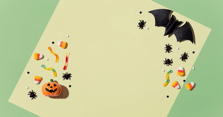 Pumpkins with Halloween decorations - overhead view flat lay