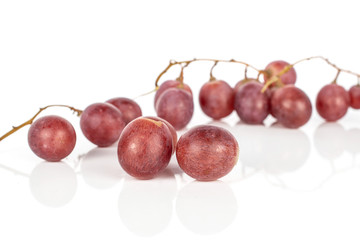 Lot of whole arranged fresh purple grape rose isolated on white background