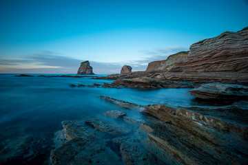 Fototapeta premium Rocas Dos Hermanas de Hendaya with cold winter retouching. France