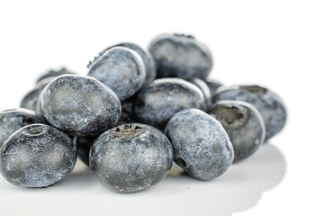 Lot of whole fresh blue blueberry heap isolated on white background