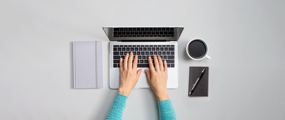 Person using a laptop computer from above